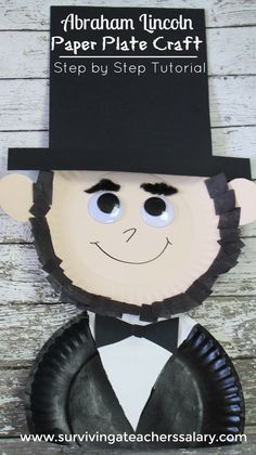 a paper plate man with a top hat and tie