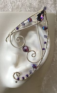 This Pair of Handcrafted Ear wraps have been created using Sterling Silver Wires, and Swarovski Crystals. This is our ‘Twist Top Tip’ (TTT) style They are Comfortable and easy to wear with a Hoop on the back making it easy to adjust; Perfect for any Festive event, Cosplay, or night out on the Town. If you have something in mind… Contact us… We Love Custom Orders. Wire Elf Ears, Kalung Choker, Halloweenský Makeup, Elf Ear, Elf Ear Cuff, Fairy Ears, Elf Ears, Fairy Jewelry, Handmade Wire Jewelry