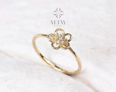 ABOUT PRODUCT This 14K Gold Flower Ring is suitable gift for girlfriend, mom and her. You can even buy as a birthday gift for your friends or anniversary gifts, If you want to add a special note we can write for you and put to inside of package. We manufacture our jewelry pieces with carefully and after production we double checking in quality control department. Our main idea is keep our items for daily wearing especially for minimalist jewelry pieces. 14K Gold Flower Ring, Diamond Daisy Ring, Flower Shaped Diamond Ring For Gift, Fine Jewelry Diamond Flower Ring As Gift, Flower Shaped Diamond Ring Gift, Flower-shaped Yellow Gold Jewelry With Halo Setting, Yellow Gold Round Flower Ring Gift, Luxury Flower Shaped Diamond Ring Gift, Yellow Gold Flower Jewelry With Halo Setting, Elegant Flower-shaped Rings For Gifts, White Gold Flower Ring With Brilliant Cut For Gift