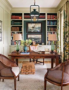 a living room filled with furniture and bookshelves