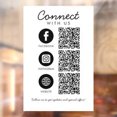 a close up of a business card with qr code and social icons on it