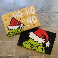 two door mats with the words oh - oh and an image of grin face on them