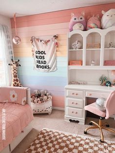 a child's bedroom decorated in pastel colors