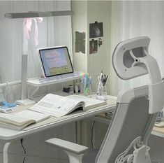 a computer desk with a monitor, keyboard and mouse