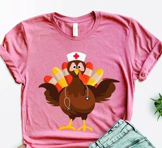 a pink shirt with a turkey on it