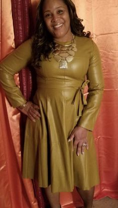 This is a beautiful brand new faux leather dress! The dress is made of 96% Polyurethane and 4% Spandex. Lining is made of 95% Polyester and 5% Elastane. It has a scoop neck style, 3/4 sleeve, casual fit, midi length, flare design, long sleeves, and back zipper closure. Must be dry cleaned. The tag on the dress has Asian sizes. Please refer to our size chart for sizing. Fitted A-line Leather Dress, Fitted Long Sleeve Faux Leather Mini Dress, Fitted Knee-length Faux Leather Mini Dress, Knee-length Faux Leather Party Dresses, Chic Fitted Faux Leather Dress, Fitted Brown Faux Leather Dress, Brown Leather Dress For Fall, Brown Fitted Faux Leather Dress, Sleek Solid Dresses For Fall