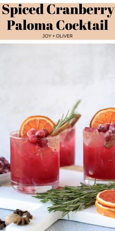 two glasses filled with blood orange cranberry paloma cocktail