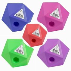 four different colored plastic dices sitting next to each other