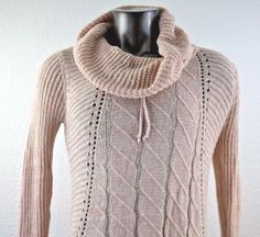 a sweater with a cowl neck is shown on a mannequin headdress