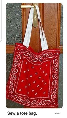 a red bandana bag hanging on a door