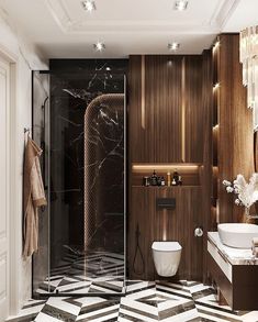 a modern bathroom with black and white tile flooring