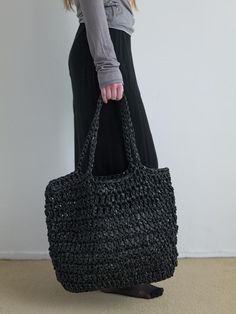 NOTHINGEVERYTHING is a brand that experiments with the diversity of materials.- This is a handmade knit big bag- Used two different textured materials- Used  polypropylene, an eco-friendly plastic material- Can be worn as a shoulder or tote bag Black Woven Plastic Bag, Modern Black Handwoven Bag, Modern Black Straw Bag For Everyday Use, Modern Black Straw Bag For Shopping, Modern Black Rectangular Straw Bag, Eco-friendly Black Crochet Bag For Travel, Black Handwoven Crochet Bag For Daily Use, Handmade Black Tote Beach Bag, Eco-friendly Black Bags With Braided Handles