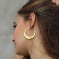 W H A T ∙ M A K E S ∙ T H I S ∙ S P E C I A L A crescent-shaped take on the classic hoop earring that draws influences from both tribal and 1970s jewellery. The half moon shapes are cut from on-trend raw silver giving them their slightly matte gold finish. Try pairing these crescent moon earrings with jeans and a loose t-shirt for a casual festival feel. Simple, delicate and versatile... you'll want in your collection. - we use only the finest quality materials - all components are 100% sterling Minimalist Crescent Hoop Earrings, Crescent Hoop Earrings With Ear Wire, Minimalist Moon-shaped Pierced Hoop Earrings, Minimalist Crescent Hoop Earrings With Ear Wire, Gold Crescent Hoop Earrings With Moon Phase, Minimalist Crescent Cartilage Earrings, Minimalist Crescent Hoop Earrings With Moon Charm, Gold Moon-shaped Cartilage Earrings, Gold Moon Shaped Cartilage Earrings