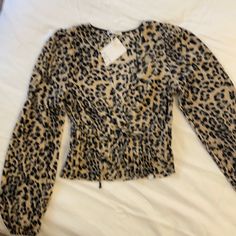 This Versatile Leopard Print Blouse From Zara Is Eye Catching. Casual Elegance. Sexy Neck Line With Drawn In Waist To Accentuate That Beautiful Figure. Dress It Up With Faux Leather Leggings Or Down With Distressed Jeans. Great Piece For Spring, Summer Or Fall. Zara Is A Trend Setting Brand That Can Always Be Counted On To Rock Your Style. Chic Leopard Print Tops For Night Out, Leopard Print V-neck Tops For Night Out, Chic Brown Stretch Blouse, Trendy Beige Blouse For Night Out, Fitted Leopard Print Blouse For Night Out, Fitted Brown Tops For Date Night, Fitted Brown Top For Date Night, Chic Leopard Print Long Sleeve Tops, Chic Leopard Print Top For Party