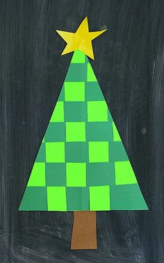 a christmas tree made out of paper on a blackboard with the words warm christmas tree written