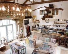 the inside of a restaurant with tables and chairs