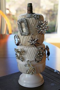 a wine bottle decorated with beads and jewels