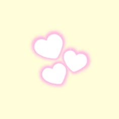 three white hearts on a yellow background with some pink light coming from the top and bottom