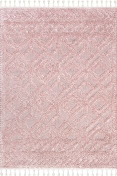 a pink rug with fringes on the bottom and an intricate design in the middle