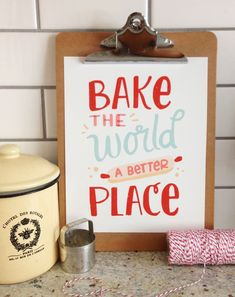 a sign that says bake the world a better place next to a crock pot