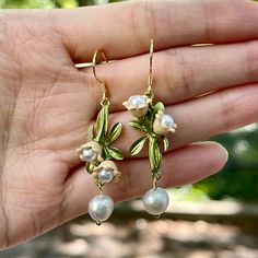 Handmade botanical flower cluster natural freshwater pearl drop gold ear wire statement earrings. Exquisite pink lily flower and green leaf in mismatched style, in addition to beautiful freshwater ivory pearls dangle. Elegant dainty bohemian vibes, carefully handcrafted. Perfect gift idea for wedding/holiday/Christmas and everyday delicate jewelry! 💎 Features:♥ Handcrafted Jewelry♥ Material: Finest 14K Gold plated ♥ Main stone: Freshwater pearl ♥ Ear Wire Closure♥ Mismatched style 💎 Details:♥ Dainty Flower Earrings, Gold Floral Jewelry, Pink Bohemian Jewelry, Pink Lily Flower, Boho Wedding Jewelry, Handwritten Gifts, Formal Earrings, Bohemian Flower, Lily Of The Valley Flowers