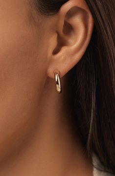 These small chunky gold hoop earrings are your daily dose of glam, made with 100% recycled solid gold. Whether you're conquering a work meeting or hitting the dance floor, you'll never want to take these beauties off and you don't have to. Pair with our Gold Paperclip Necklace to bring your solid gold look together. Waterproof, tarnish-proof recycled solid gold Revamp your go-to earring stack with a gold & bold touch Perfect for stacking or wearing on its own Width: 17.9mm - 0.7" Depth: 4mm - 0. Gold Paperclip Necklace, Earring Stack, Chunky Gold Hoop Earrings, Paperclip Necklace, Work Meeting, The Dance, Anniversary Sale, Gold Hoop, Dance Floor