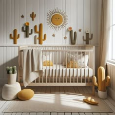 a baby crib in a white room with cactus and sun decorations on the wall