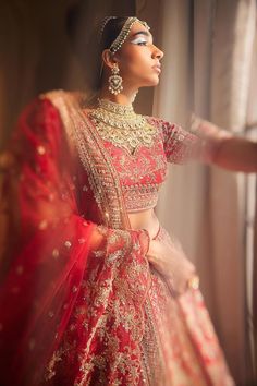 Red raw silk attached cancan lehenga with zardozi, thread, cutdana, sequin, bead embroidery in floral and geometric pattern. Paired with half sleeve embroidered padded blouse and embroidered dupatta.
Components: 3
Pattern: Embroidery
Type Of Work: Zardozi, thread, cutdana, sequin, bead
Neckline: Sweetheart neck
Sleeve Type: Half sleeves
Fabric: Raw Silk
Color: Red
Other Details: 
Lehenga:
Attached cancan
Floral pattern
Length: Approx 43 - 44 inches
Blouse:
Padded
Dupatta:
Scallop hem
Embroidered Sweetheart Neckline Blouse, Cancan Lehenga, Sabyasachi Bride, Raw Silk Lehenga, Lehenga Red, Padded Blouse, Embroidered Lehenga, Scallop Hem, Embroidered Dupatta