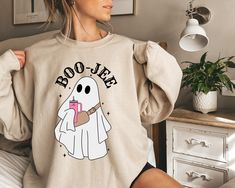 📍Boo Jee Ghost Sweatshirt, Boujee Sweatshirt, Boo Jee Shirt!  📍Handmade with Love! 📍Shirts are Unisex TShirts and SO Soft!! We proudly use Bella Canvas! 📍These are True to Size, Size Charts are provided on each listing. 📍Colors Available will be listed on each listing. 📍DESIGN is DTF printing. The ghost will be white as shown.  📍Processing Time: 3-5 business days. Shipping Options available at check out. 📍Returns & Exchanges: No returns or exchanges will be accepted as these are made to Pumpkin Gift, Ghost Sweatshirt, Boo Shirts, Ghost Design, Spooky Ghost, Fall Tee, Ghost Shirt, Halloween Sweatshirt, Halloween Ghost