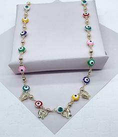 "Christmas season is a great period to give gifts. Enjoy a special collection just having you in mind. It's time to celebrate. Time to give, time to receive. Time to spread love. 18k Gold Filled Evil Eye Beaded Necklace with 4 plain gold color butterfly charms 18\" Length + 2\" Extension Buy with confidence we add insurance to every shipping package. Our Etsy store was developed to help you find the most unique styles of modern designs, always looking for elegance and market trends. Here you wil Gold Pendant Jewelry, Protection Necklace, Elephant Charm, Knot Necklace, Solid Gold Jewelry, Gold Charm, Gold Filled Jewelry, Wholesale Jewelry, Evil Eye