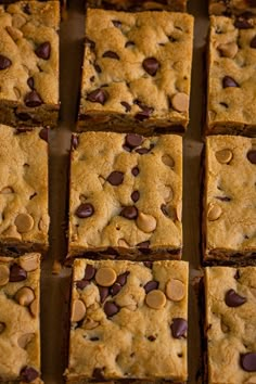 chocolate chip cookie bars cut into squares on a baking sheet, ready to be eaten