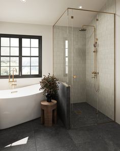 a bathroom with a bathtub, sink and window