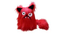 a red stuffed animal with big eyes and long hair