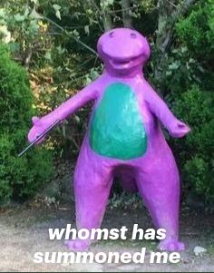 a purple and green statue with words on it that say, whoms has summoned me