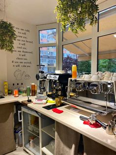 a coffee machine sitting on top of a counter next to a window