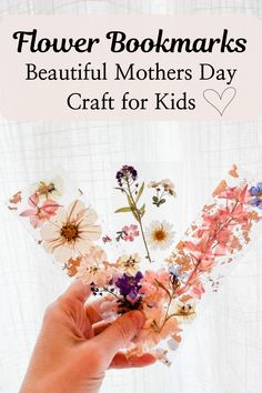 a person holding flowers with the text flower bookmarks beautiful mothers day craft for kids