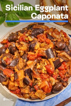 an eggplant and caponata dish on a plate with bread in the background