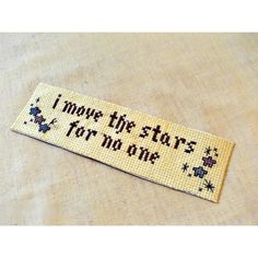 a cross stitch bookmark that says i move the stars for no one on it