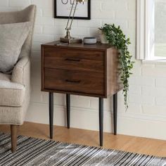 a brown wooden cabinet sitting on top of a hard wood floor next to a chair