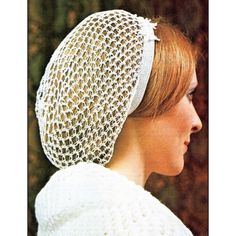 a woman wearing a white knitted bonnet