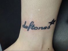 a tattoo that reads deftones on the ankle