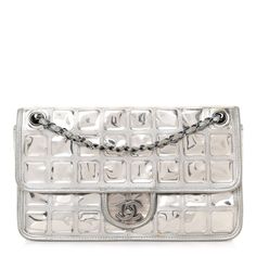 This is an authentic CHANEL Vinyl Large Ice Cube Flap in Silver. This stylish shoulder bag is crafted of decorative, mirrored vinyl featuring squared quilting at the front and back with signature silver leather Chanel diamond quilting at the sides. The bag features polished silver chain link shoulder straps threaded with silver leather and a front Chanel CC turn lock for the front flap. This unique handbag opens to a gray satin interior with a zipper pocket. Mirror Vinyl, Chanel Crossbody, Unique Handbag, Silver Bags, Chanel Shoulder Bag, Stylish Shoulder Bag, Chanel Vintage, Designer Shoulder Bags, Chain Shoulder Bag