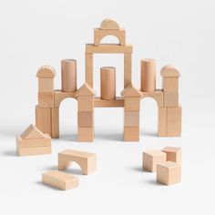 wooden blocks and shapes arranged in the shape of a castle