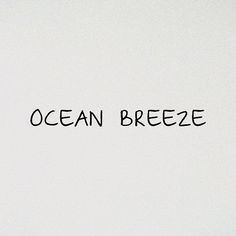 the words ocean breeze are written in black ink