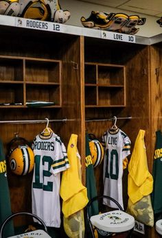 green bay packers jerseys hang in the locker room