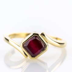 A piece from our collection, featuring a natural ruby of 2.0 carats set into a timeless yellow gold design.   Metal 14k / 0.585 gold Gemstones 1 ruby 2.0ct Measurements Head 9.0mm Shank 2.1mm Ring size 7 US Weight 3.8g Condition New General Information All items come with certificate of authenticity, gemstones have been tested at our lab if not otherwise indicated. Pendants are shown with chain for decorational reasons, please note that they do not come with a chain. Payment We accept payment th Red Ruby Ring In 14k Gold With Bezel Setting, Classic Ruby Diamond Ring In Yellow Gold, Classic Yellow Gold Ruby Ring With Lab-created Ruby, Red Ruby Birthstone Ring Stamped 14k, Ruby Birthstone Ring In Yellow Gold, Formal Ruby Ring In Yellow Gold, Emerald Cut Solitaire Ruby Ring, Anniversary Ruby Ring In Yellow Gold, Gold Emerald Cut Ruby Ring