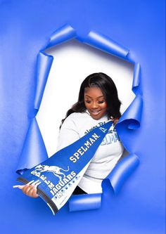 a woman holding a blue scarf in front of a white background with the words scream on it