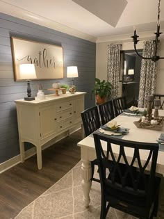 a dining room table and chairs with the words storm cloud williams on it's wall