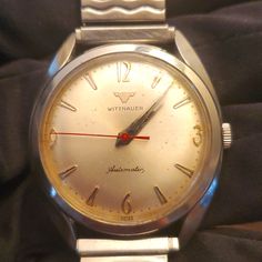 1950's Wittnauer Mens Automatic Watch Timepiece. My Father Owns This And Has Had It For Most Of His Life ; He's 82 Now. He Told Me It Has Never Stopped Working. It's Been In His Drawer Not Being Used For At Least 50 Yrs And It's Still Kickin!Kicking!! Definitely Quality At Its Finest! Vintage White Watch With Tachymeter, Vintage White Analog Watch, Vintage White Automatic Watch Accessories, Vintage White Watch Accessories With Round Dial, Vintage White Round Dial Watch Accessories, Retro White Watches For Formal Occasions, White Retro Watch For Formal Occasions, White Retro Formal Watch, White Retro Formal Watches