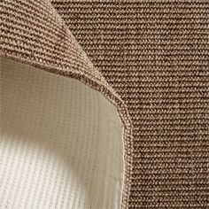 a close up view of the back end of a chair with a brown and white pattern on it